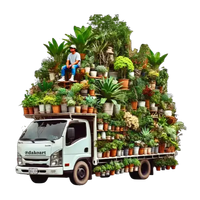 Camion blanc avec des plantes en pot à l'arrière